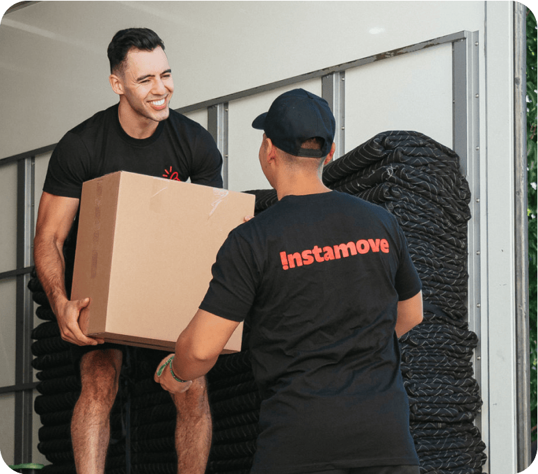 A wall of labelled moving boxes ready by the door to speed up loading