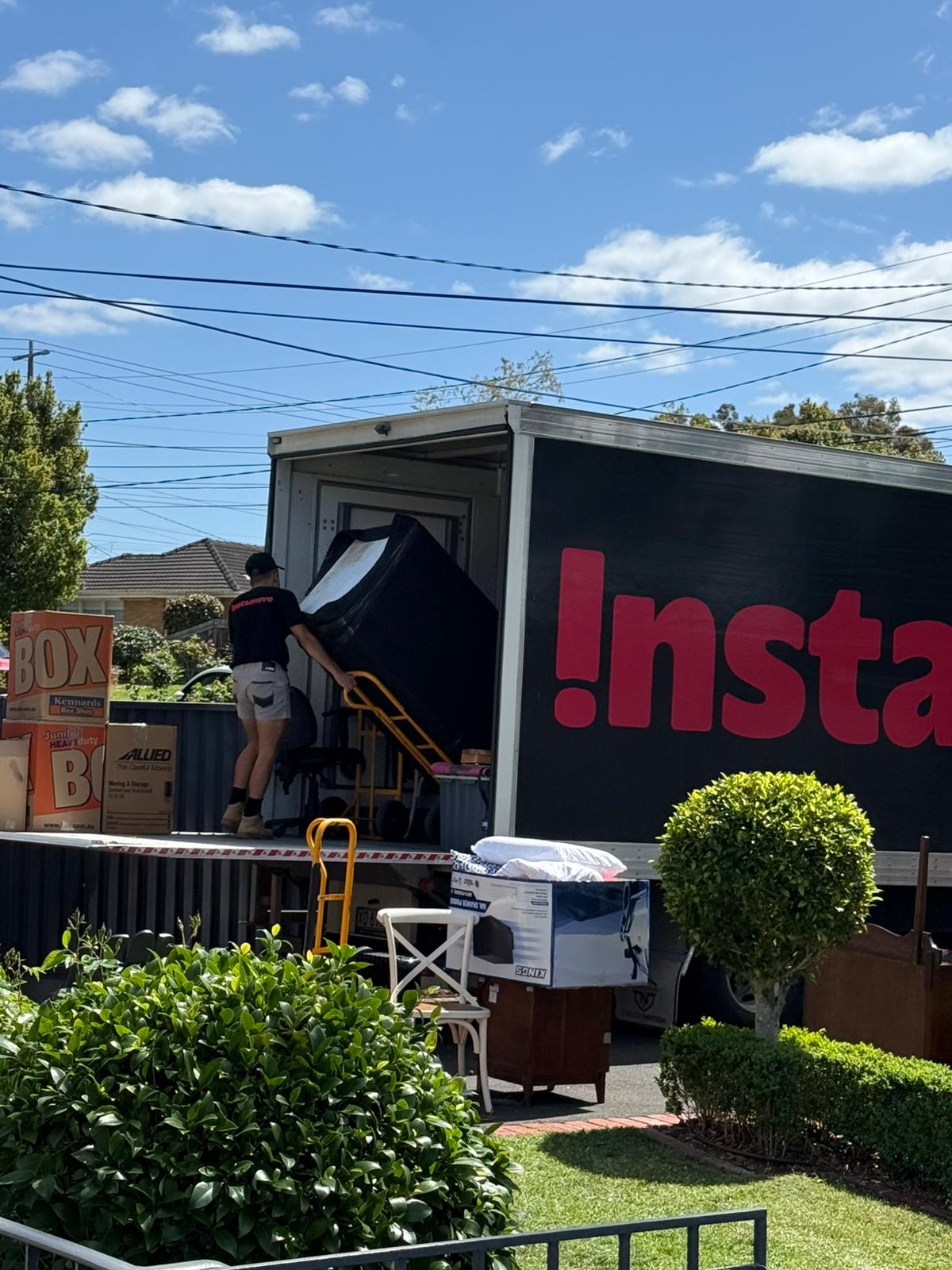 Instamove crew loading a backloading truck